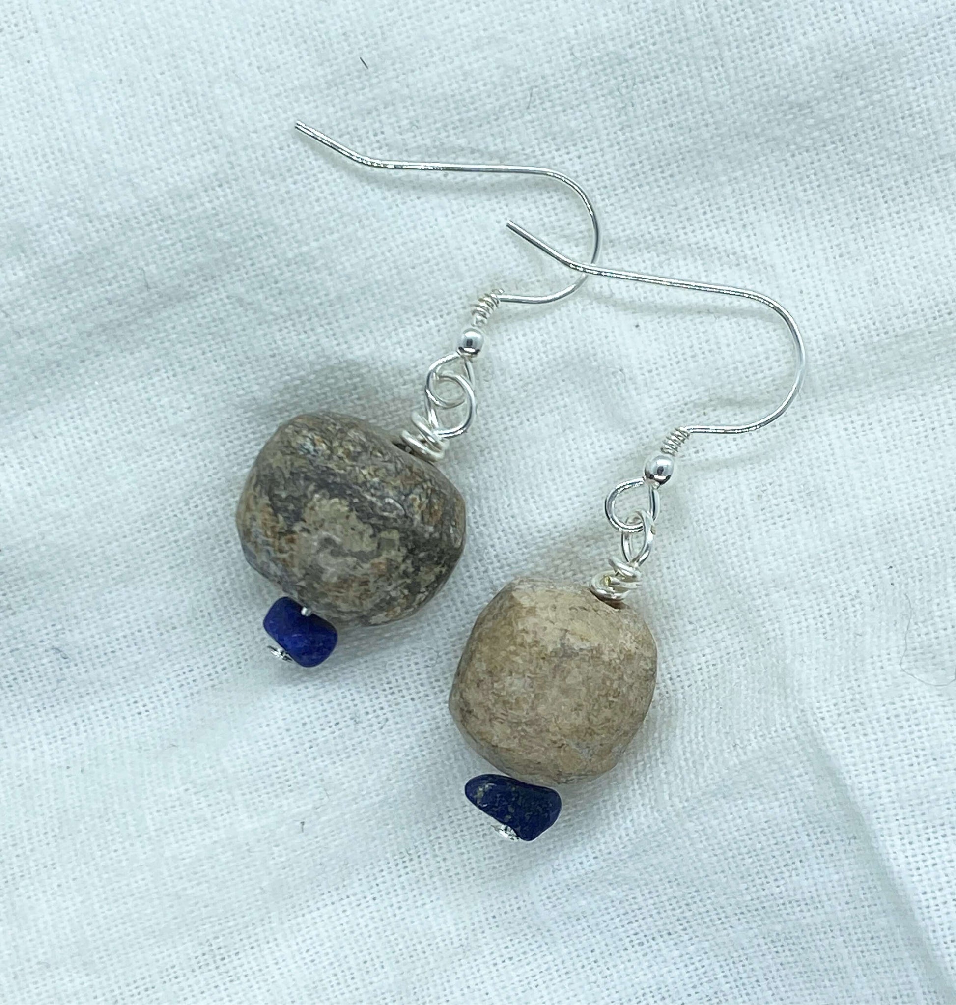 Personalised  Earring are made from 30,000 year mammoth beads found on the Jurassic coast in the south of England