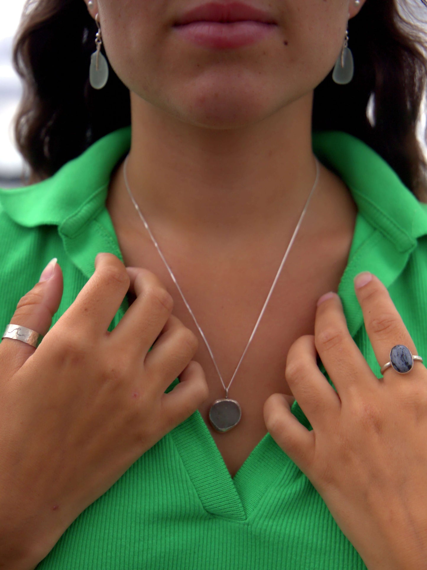 Model wearing Victorian sea glass necklaces hand made by earth and silver