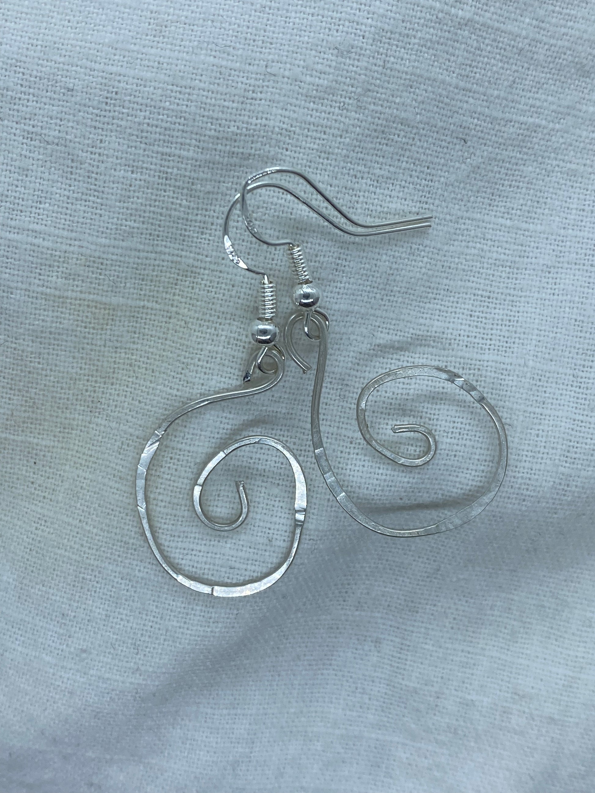 Silver Spiral earrings that have been textured