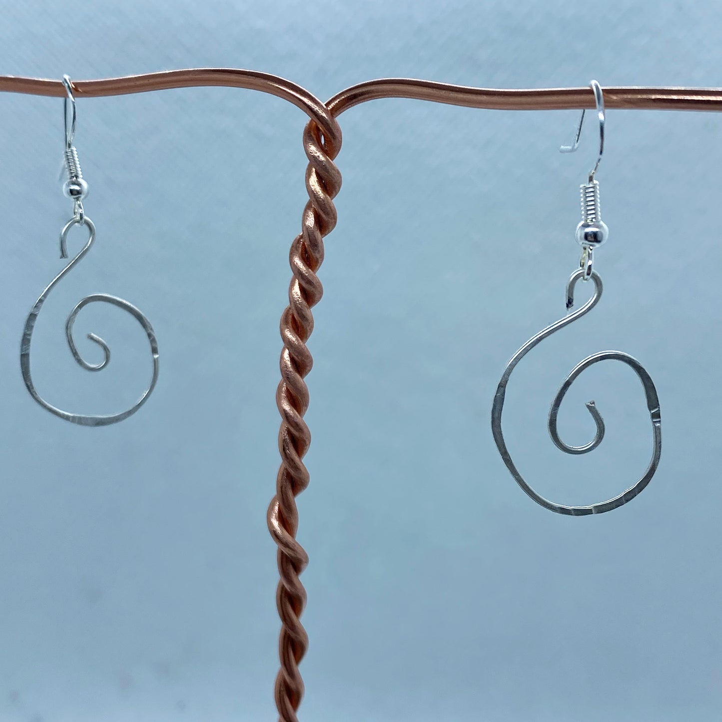 Silver Spiral earrings that have been textured