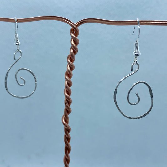 Silver Spiral earrings that have been textured