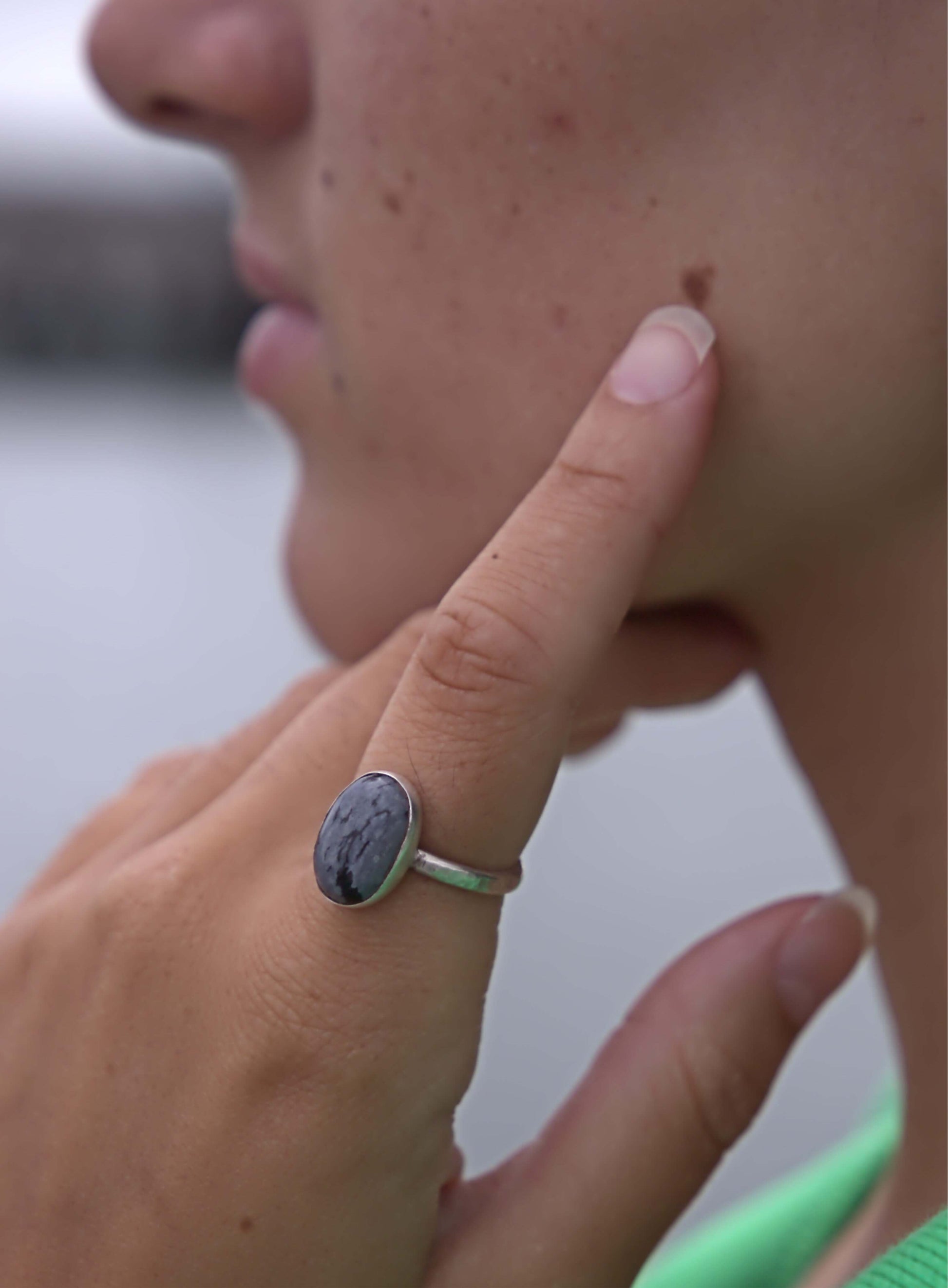 Model wearing Earth and Silver hand made snowflake ring